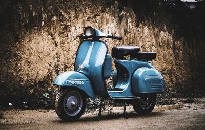 Vintage car parked against wall