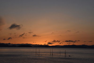 Scenic view of beach against sky during sunset