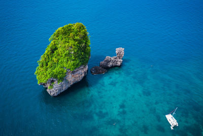 High angle view of rocks by sea