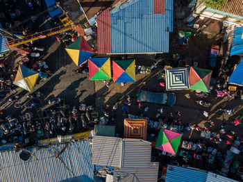 High angle view of flags hanging in city