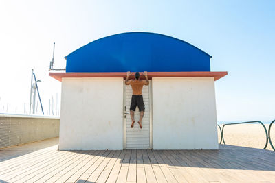 Sportsman practicing stretching and calisthenics