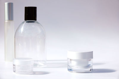 Close-up of wineglass on table against white background