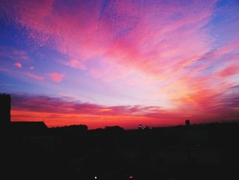 Silhouette of built structure at sunset