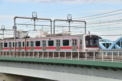 Train at railroad station against sky