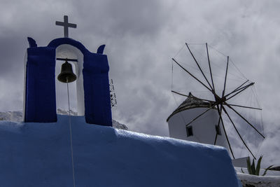 Santorini, greece, may 5, 2024. oia, view of the village with the windmill, cross and bell