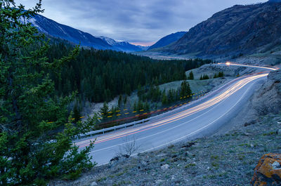 Scenic view of mountain road at dusk