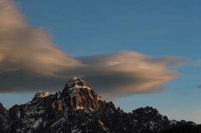 Low angle view of rock formation against sky during sunset