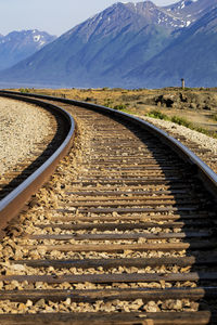 View of railroad tracks against mountain