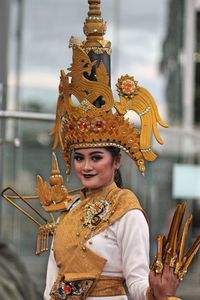 Portrait of smiling young woman wearing costume during traditional festival