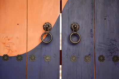 Close-up view of door lock at wooden door