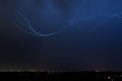 Low angle view of lightning in sky at night