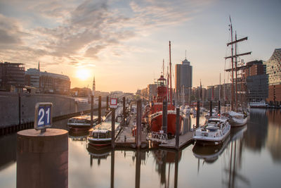 Boats moored at harbor