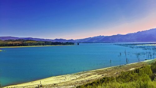 Scenic view of calm sea against clear sky