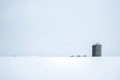 Building against clear sky during winter