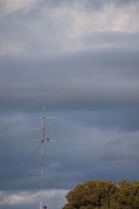 Low angle view of windmill against sky