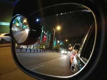 Vehicles on road in city at night
