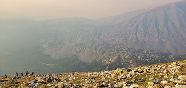 High angle view of crowd on mountains against sky