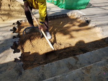 Low section of man working at construction site