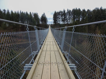 View of footbridge against sky