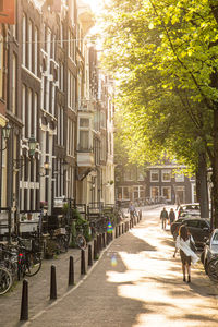 Bicycles on footpath by buildings in city