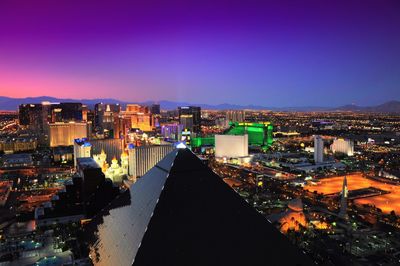 High angle shot of illuminated cityscape against sky