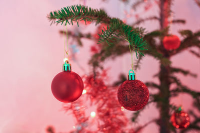 Close-up of christmas decorations hanging on tree