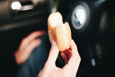 Close-up of hand holding ice cream