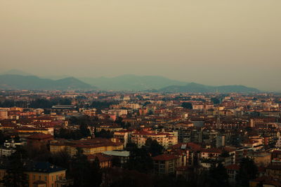 High angle shot of townscape against sky at dusk
