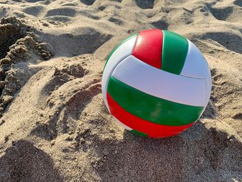 High angle view of multi colored ball on sand