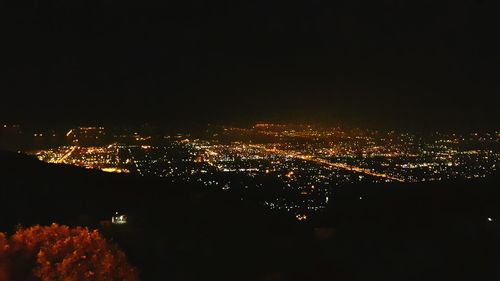 Aerial view of illuminated cityscape