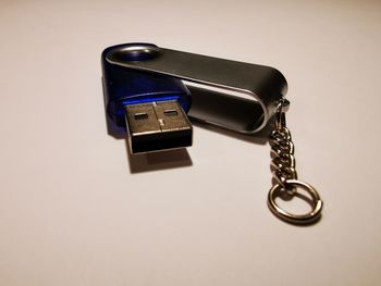 High angle view of telephone on table against white background