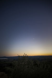 Scenic view of silhouette landscape against sky at night