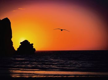 Scenic view of sea against clear sky during sunset