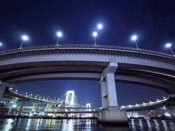 Low angle view of bridge against sky at night