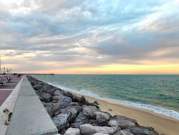Scenic view of sea against cloudy sky