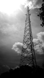 Low angle view of communications tower against sky