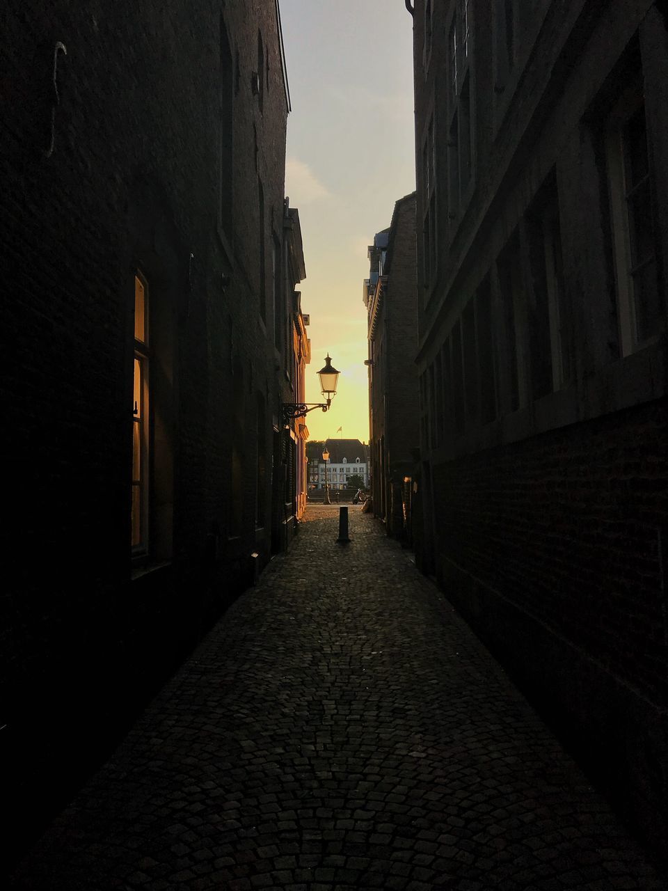 NARROW STREET AMIDST BUILDINGS IN TOWN