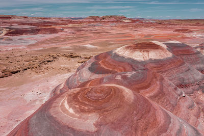 Red layered rocks and mesas that look like mars, utah, usa, drone view