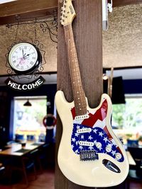 Close-up of guitar on table at home