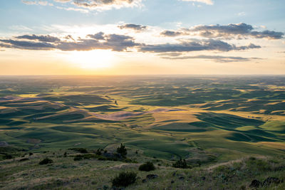 Aerial view of landscape against sky during sunset