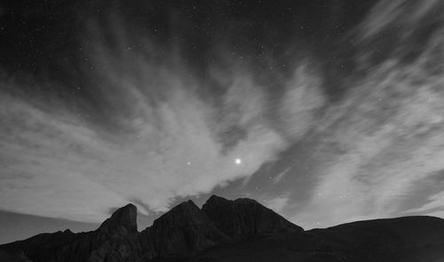 Low angle view of mountain against sky at night