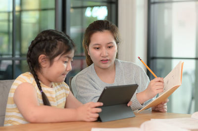 Young woman using laptop at home