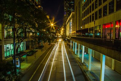 Illuminated city street at night