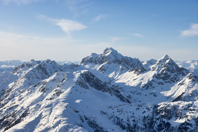 Scenic view of snowcapped mountains against sky