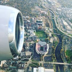 High angle view of airplane flying over osu stadium 