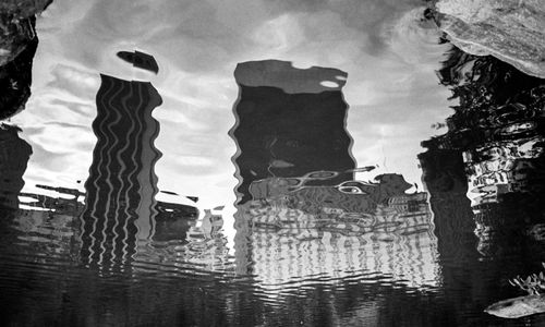 Low angle view of reflection in water against sky