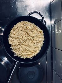 High angle view of pasta in cooking pan