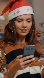 Young woman using smart phone