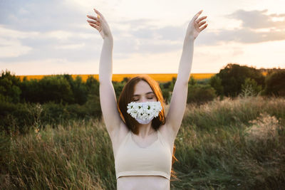 Statement masks, blinged out diy flower face mask design. girl in face mask decorated with flowers 