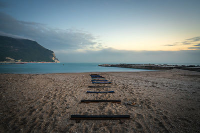 Scenic view of beach against sky during sunrise